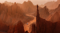 Off-road vehicles driving through red sandstone canyon formations in Xinjiang
